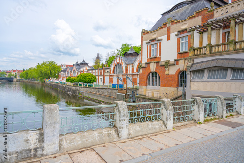 The striking Art Nouveau building of the Hucak hydroelectric power station stands proudly along the river in Hradec Kralove, showcasing its intricate design and historical significance in the region. photo