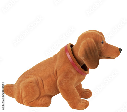 niedlicher, retro Wackeldackel (Welpe) mit Dackelblick sitzt 