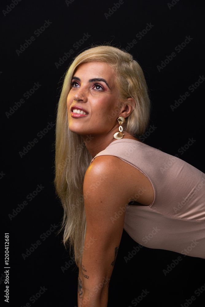 Beautiful blonde Caucasian model wearing a bodycon dress posing for a photo. Isolated on a black background. Salvador, Bahia. Beautiful blonde Caucasian model wearing a bodycon dress posing for a photo. Isolated on a black background. Salvador, Bahia.