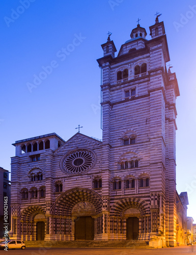 View of Cathedral of San Lorenzo, main religious building of city of Genoa in twilight photo