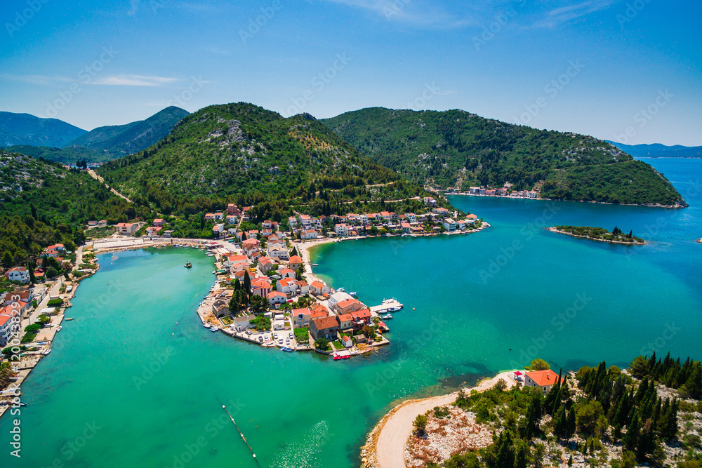 Fototapeta premium Blace Coastal Village Aerial View, Southern Croatia. Stunning Lagoon Surrounded by Scenic Hills and Clear Adriatic Waters