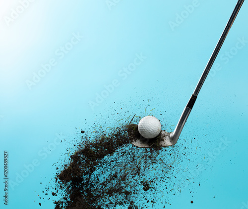 Golf ball explode from Tee off. Golfer hit ball with metal iron club to grass soil explosion on green. Golf club hit ball on green tee off with grass flying scatter. Blue Sky background isolated photo