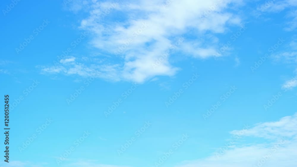 A Time lapse video captures the fluffy white clouds across a radiant blue sky. Atmospheric circulation concept. Nature stock footage. Timelapse. Cloud background. 4K.
A Time lapse video captures the fluffy white clouds across a radiant blue sky. Atmospheric circulation concept. Nature stock footage. Timelapse. Cloud background. 4K.