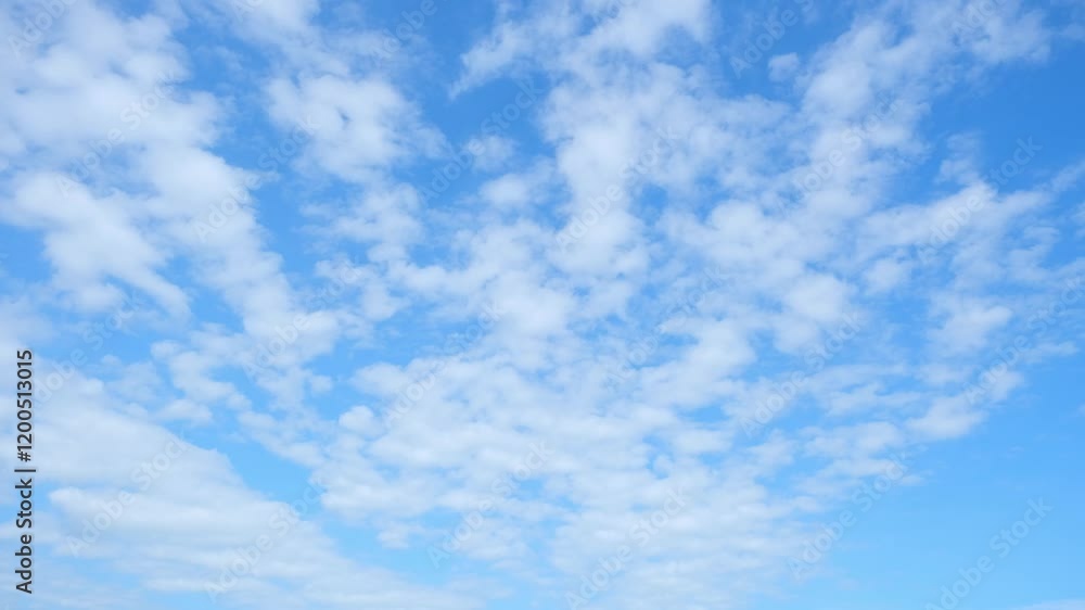 4K : Time-lapse video showcasing the dynamic movement of fluffy white clouds across a serene blue sky. Timelapse. Sky background.
4K : Time-lapse video showcasing the dynamic movement of fluffy white clouds across a serene blue sky. Timelapse. Sky background.