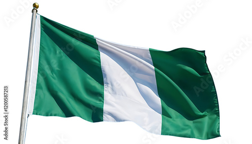 Nigeria’s national flag fluttering in the breeze with a bright blue sky behind it.