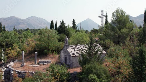 Drone orbiting around old stone church Saint-Mitre in Ravno town in Bosnia and Herzegovina