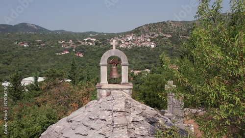 Flying over old stone church Saint-Mitre bell to revile Ravno town in Bosnia and Herzegovina