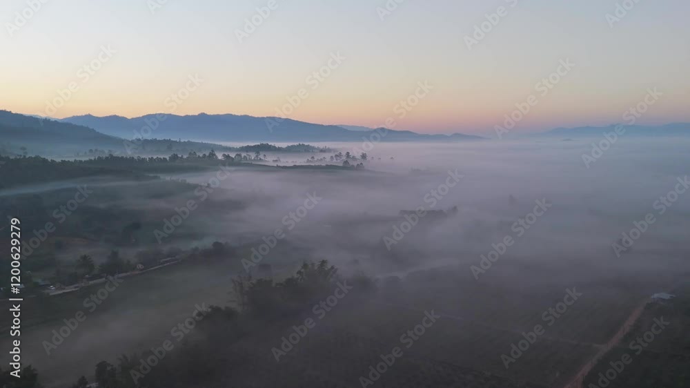 Aerial view of misty morning in mountain hills Aerial view of misty morning in mountain hills