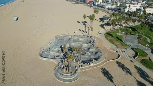 A drone shot of the Venice Beach Skate Park, capturing skaters in action and the surrounding vibrant atmosphere.