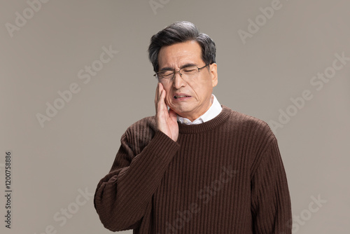 Senior man suffering from toothache