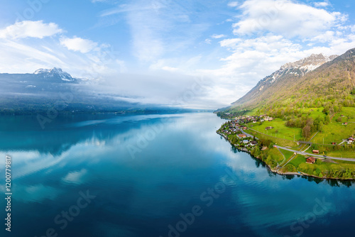 Aerial and spring view of low altitude light clouds on Lake Brienz and houses on the hill of Oberried near Baden-W?rttemberg, Switzerland photo