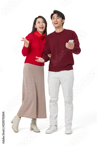 Excited young couple with smart phone