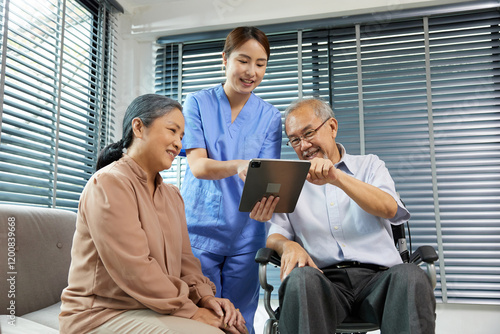 nurse or caregiver helping senior man sitting on wheelchair and senior woman support her at home