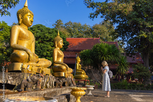 A young female tourist in the ancient city Chiang Saen in Thailand photo