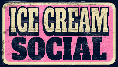 Aged and worn ice cream social sign on wood