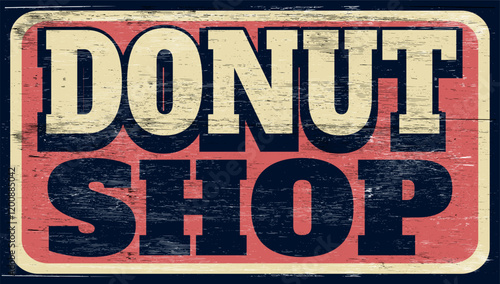 Aged vintage donut shop sign on wood