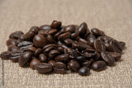 A high-quality photograph of carefully selected coffee beans, showcasing their rich texture and natural colors. Perfect for use as a background in designs, advertisements for coffee shops, cafes, or o photo