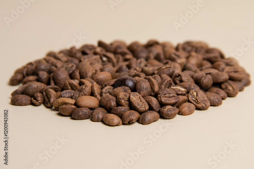 A high-quality photograph of carefully selected coffee beans, showcasing their rich texture and natural colors. Perfect for use as a background in designs, advertisements for coffee shops, cafes, or o