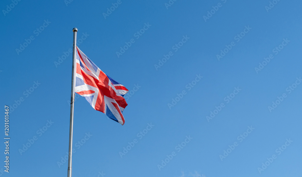 British flag flying in the blue sky British flag flying in the blue sky