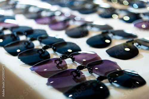 Clip sunglasses are displayed in the store