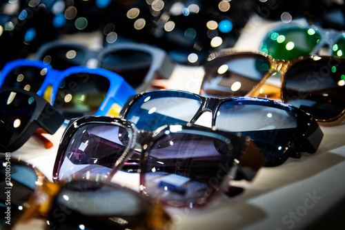 Many sunglasses are displayed in the store