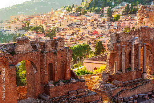 View at town Taormina, old touristic place in Sicily, Italy. Taormina town coastal view.  Sunny old italian town, Mediterranean Coast in Europe photo