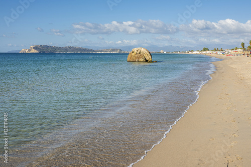 Fototapeta Naklejka Na Ścianę i Meble -  Poetto beach in Cagliari, with blue water and a characteristic rock in the sea
