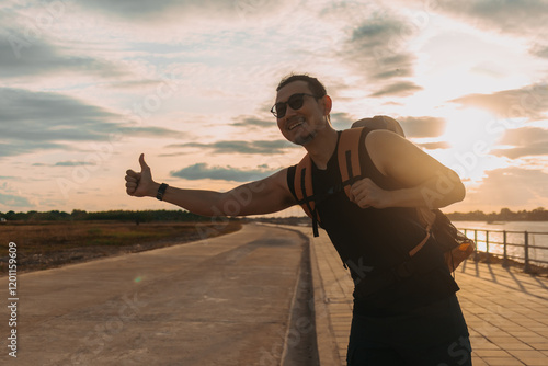 Canvas Print Man tourist backpacker hitchhike for pickup on the local country road