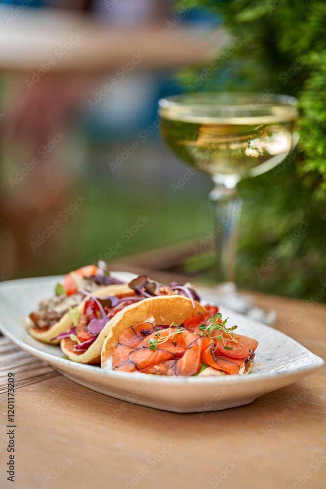 A vibrant and refreshing trio of tacos, each filled with slices of smoked salmon, fresh vegetables, and a drizzle of creamy sauce A vibrant and refreshing trio of tacos, each filled with slices of smoked salmon, fresh vegetables, and a drizzle of creamy sauce