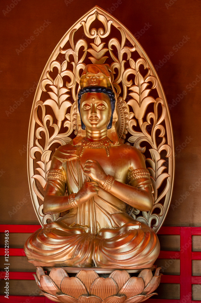 Fototapeta premium Tahoto Tower - repository of relics. Buddha figure in gold close-up. Architecture copy of building, built in Japanese Garden of Krasnodar, dates back to 1185–1333. Krasnodar Park or Galitsky Park.
