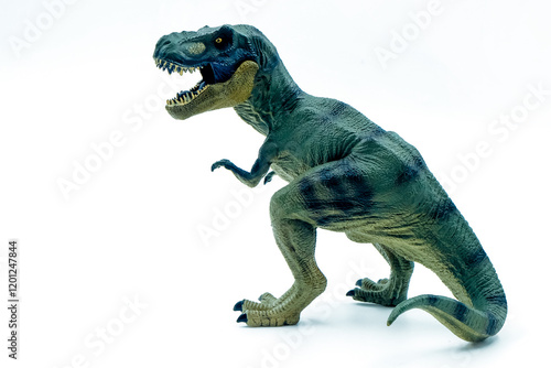 Fotografie Green toy dinosaur with open mouth