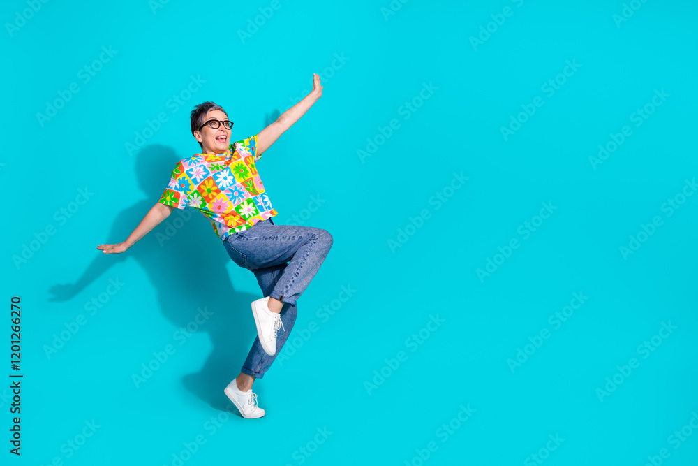 Full size photo of nice aged woman dance empty space isolated on teal color background Full size photo of nice aged woman dance empty space isolated on teal color background