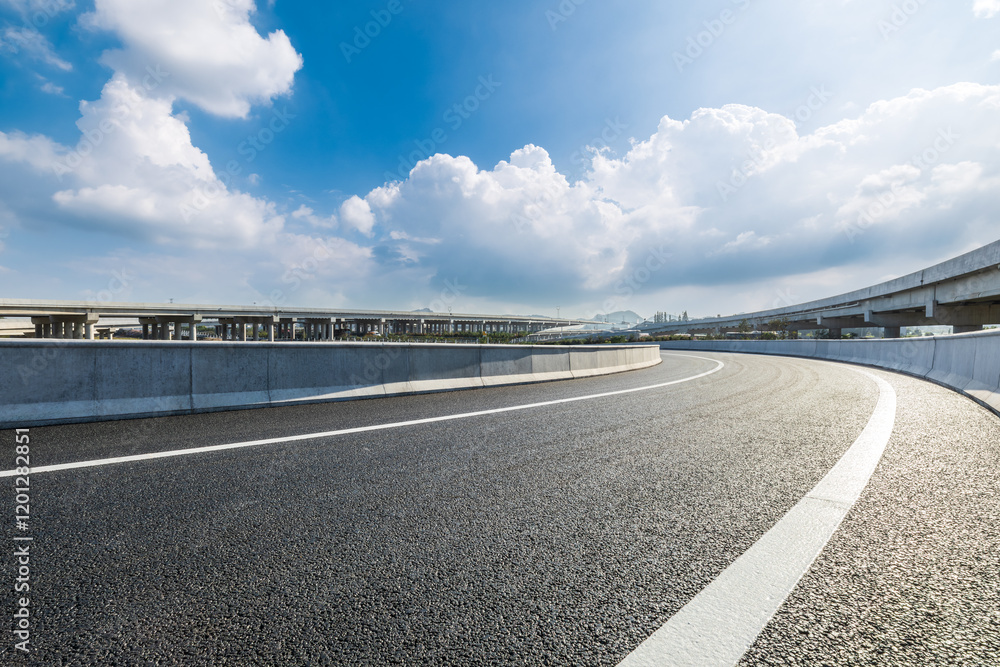 Empty curved highway and sky cloud background Empty curved highway and sky cloud background