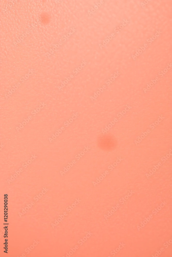 Fototapeta premium peach colored background, soft texture, subtle gradient, delicate polka dot pattern, muted tones, minimalist design, abstract composition, gentle lighting, pastel aesthetic, dreamy atmosphere