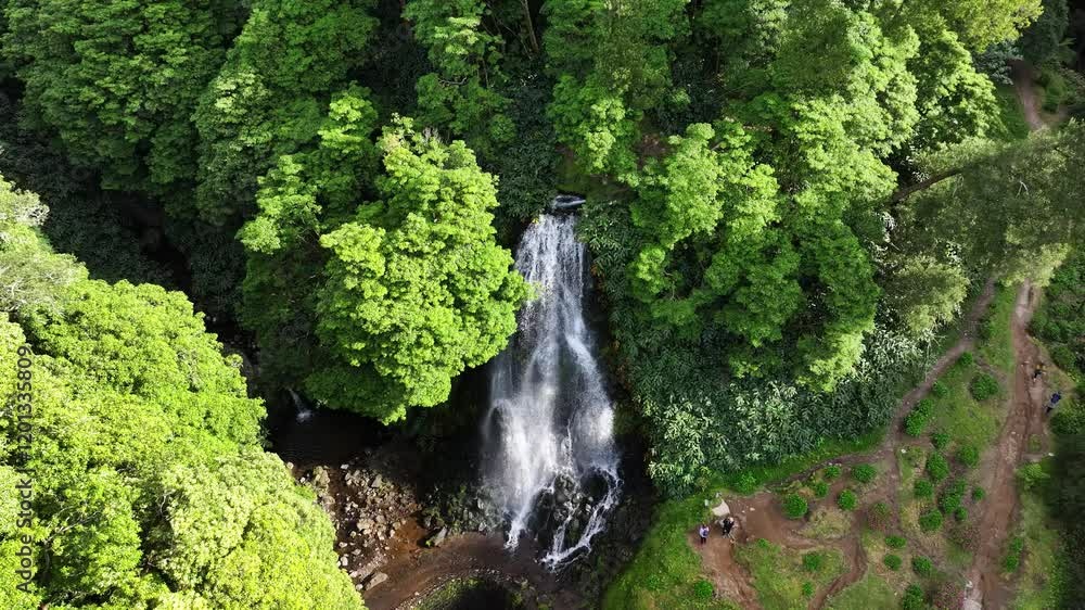 Tourists visit waterfall attraction at Ribeira dos Caldeirões, Sao Miguel. Aerial Tourists visit waterfall attraction at Ribeira dos Caldeirões, Sao Miguel. Aerial