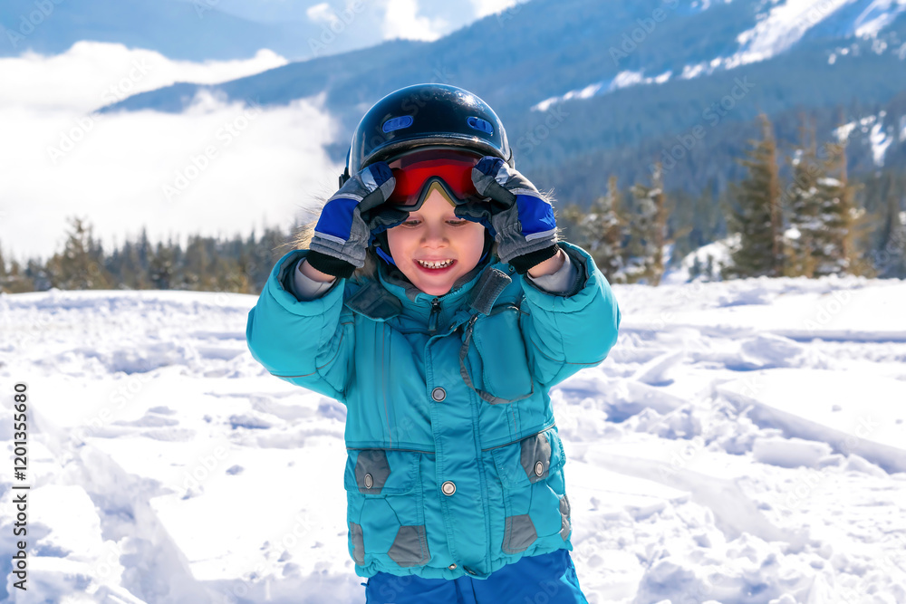 Active adorable kid boy in helmet,goggles having fun learn skiing in mountains alpine winter resort.little child enjoy extreme sport activities recreation,family luxury vacation Active adorable kid boy in helmet,goggles having fun learn skiing in mountains alpine winter resort.little child enjoy extreme sport activities recreation,family luxury vacation