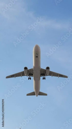 ULTRA HD. 4K. Airplane flies in blue sky. Travel, tourism. Airplane takes off against the background of blue sky.	
