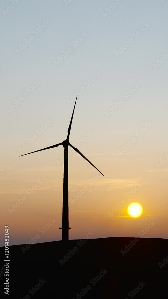 Wind power plant tower. Windmill farm. Sustainable energy production. Green energy, clean power, clean energy concept. Wind power plant tower. Windmill farm. Sustainable energy production. Green energy, clean power, clean energy concept.