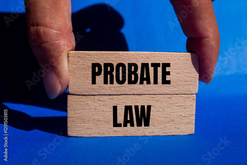 Probate law message written on wooden blocks with blue background. Conceptual probate law symbol. Copy space. photo