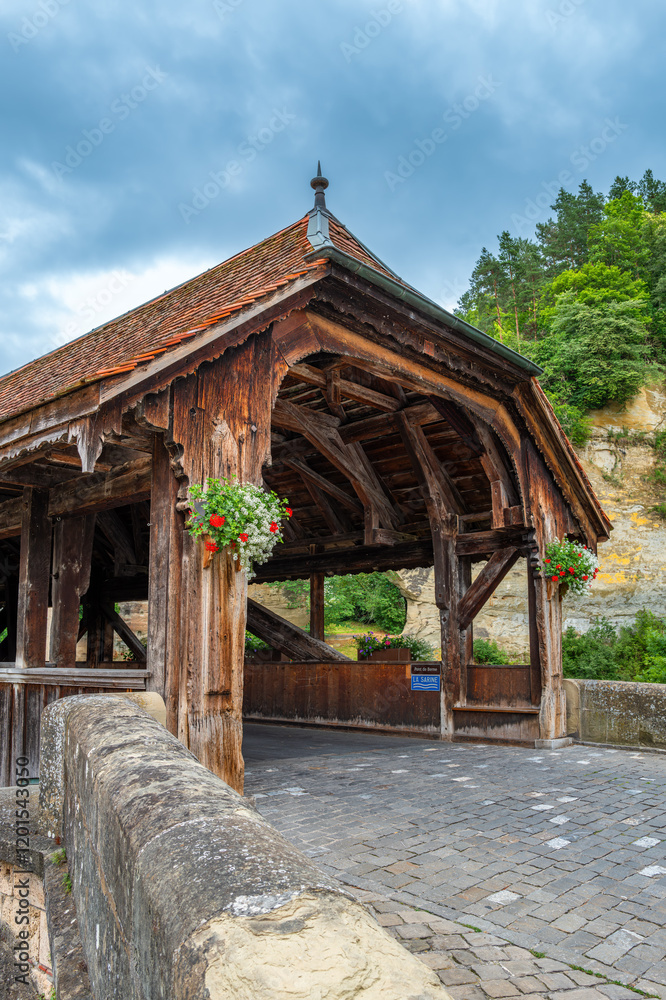 Wooden covered bridge Pont de Berne in Fribourg with stone path Wooden covered bridge Pont de Berne in Fribourg with stone path