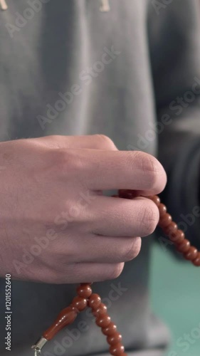 Young muslim man praying