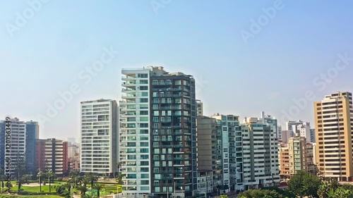 Wallpaper Mural Modern city buildings along Lima's Costa Verde, with the Pacific Ocean and Malecon Cisneros in the background Torontodigital.ca