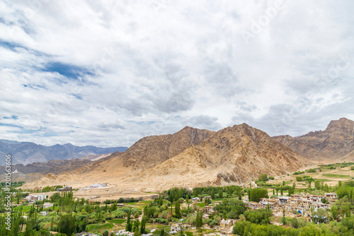 view of leh city surrounded by beautiful himalayan mountains, passing through the khardung la road in the ladakh district, India. photo