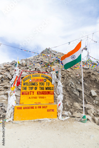 View of beautiful Himalayan mountains and tourist activities near the Monument of Khardungla at Khardungla Pass, Ladakh, in India.