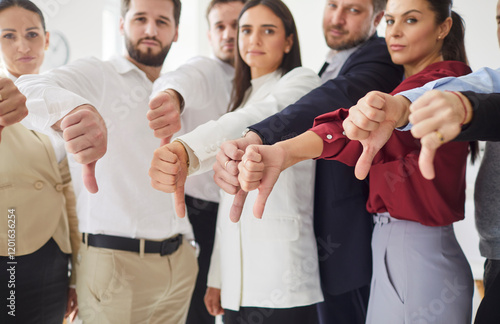 Quadro su tela Group of serious professionals standing together in office, all giving thumbs down gesture