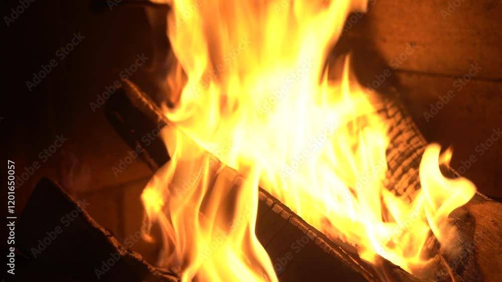 Fire in fireplace burns firewood with zooming in. Charred logs burning. Bonfire heat house. 4K Fire in fireplace burns firewood with zooming in. Charred logs burning. Bonfire heat house. 4K