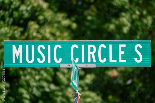 Street sign indicating Music Circle S located in a vibrant neighborhood surrounded by lush greenery in downtown Nashville, Tennessee photo