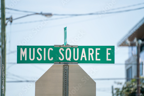 Street sign for Music Square East in an urban setting on a sunny day