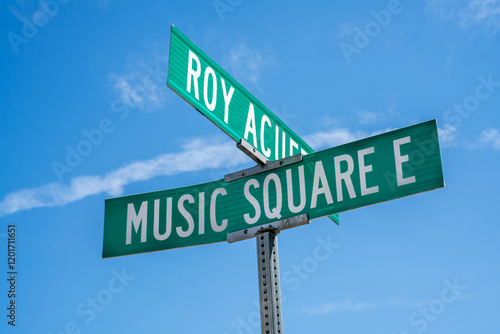 Signage marking the intersection of Roy Acuff and Music Square E in Nashville, Tennessee on a sunny day in the city