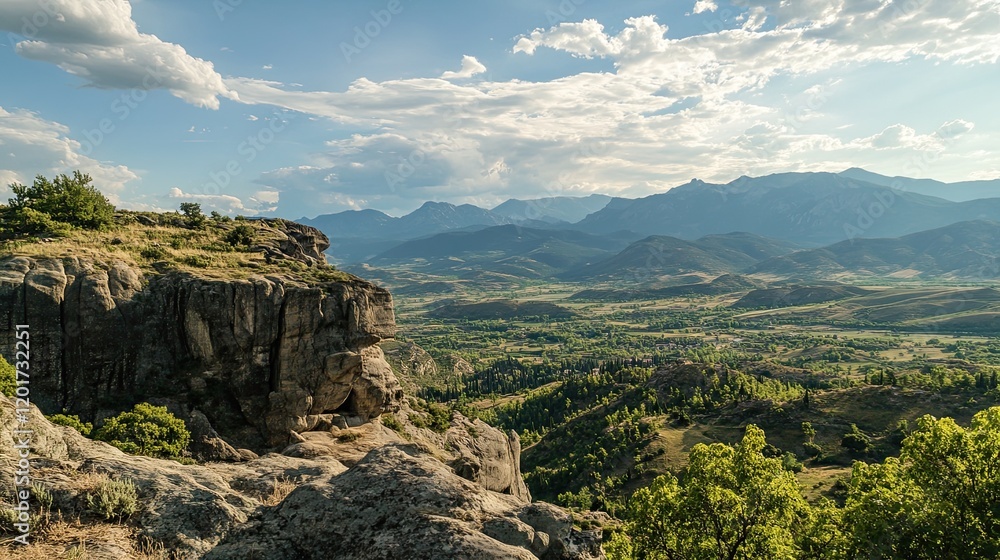 Naklejka premium Mountain valley landscape, scenic view from rocky outcrop, summer day
